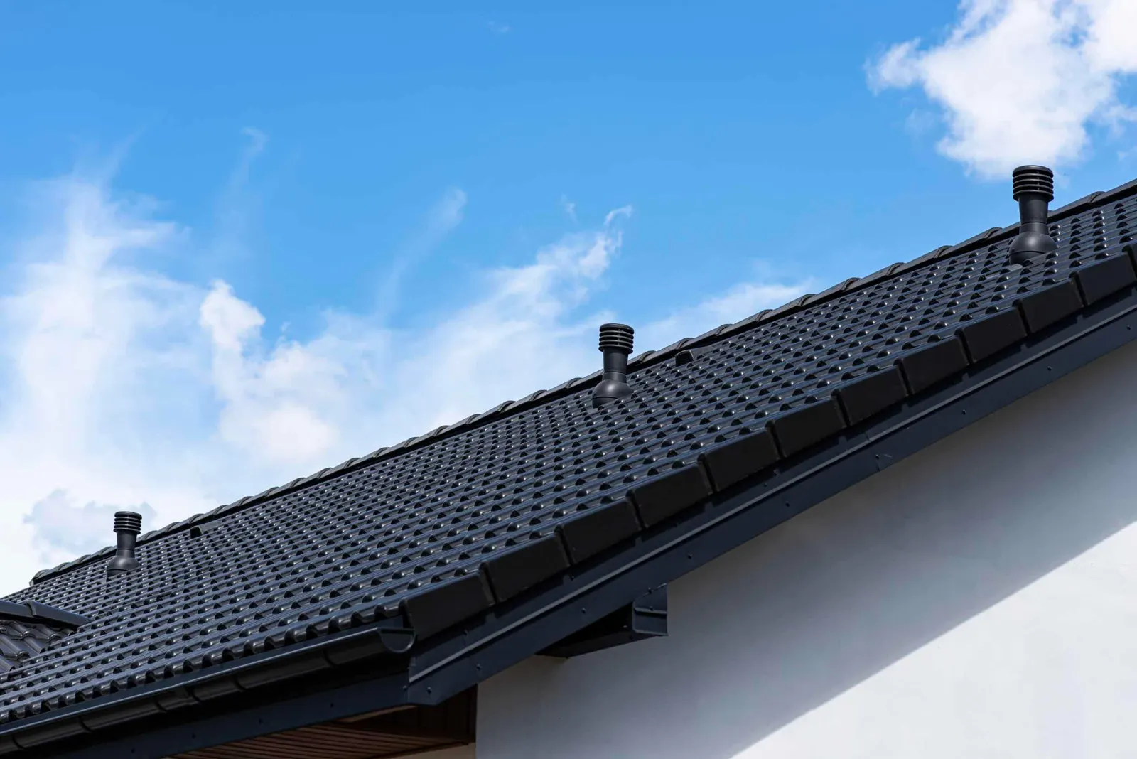 Specialty tile roof with vents