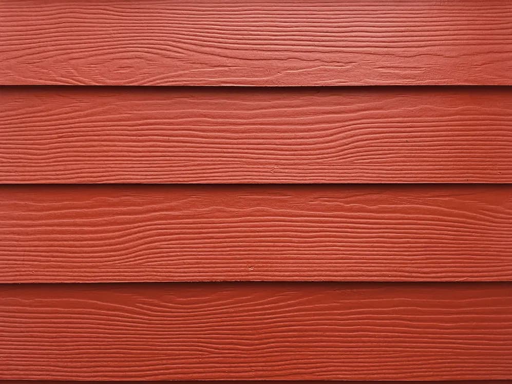 Composite siding with a wood look